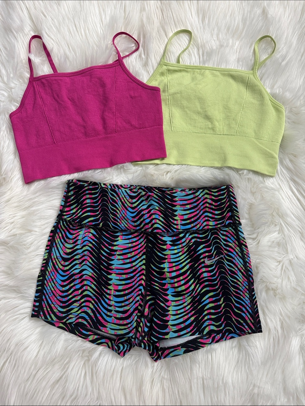 2 Fabletics ribbed sports bra with Nike running shorts